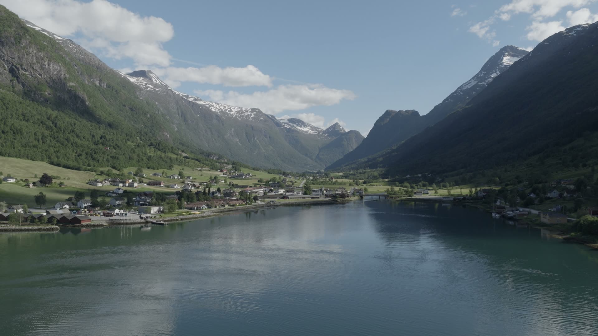 Alpine fjord valley with waterfront settlement, Olden