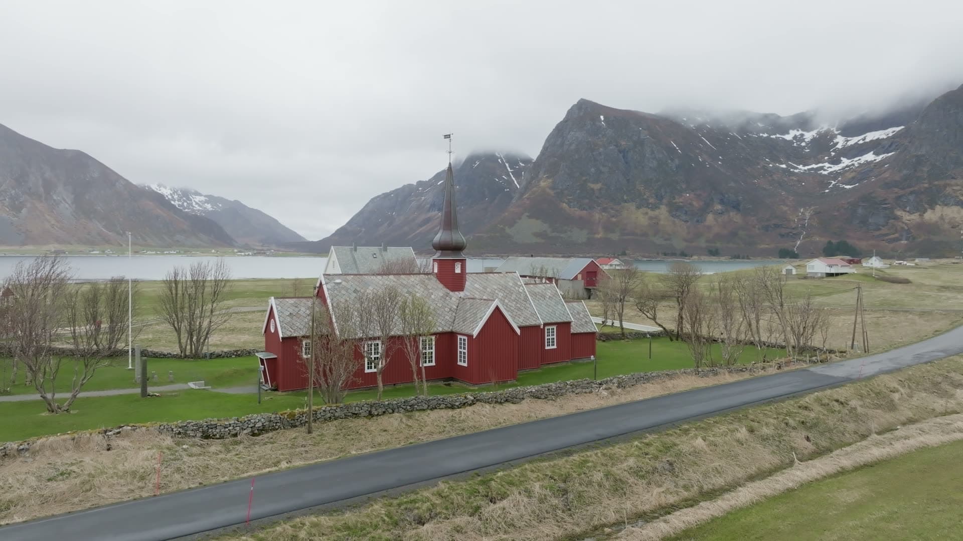 Red church in mountain fjord valley, Flakstad kirke