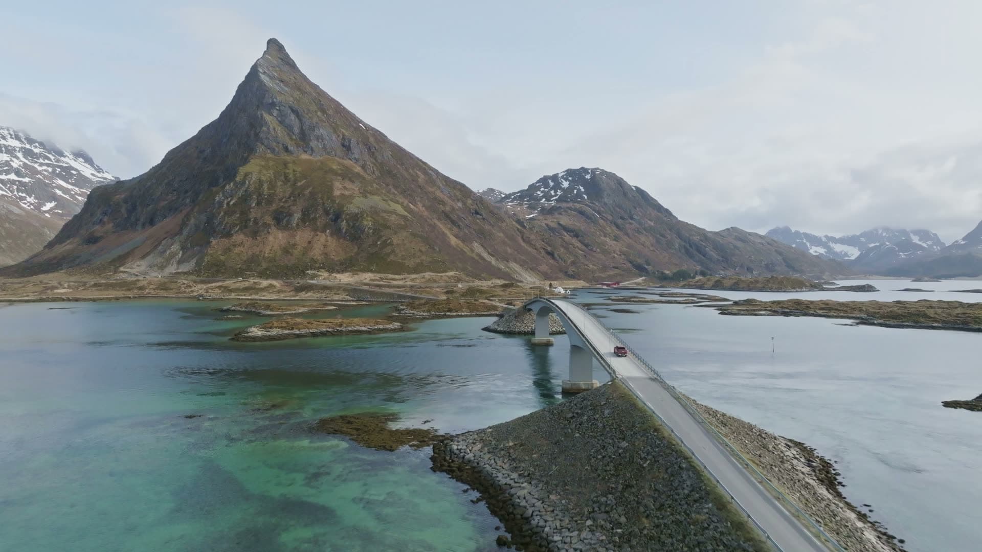 Long causeway bridge to mountain fjord, Flakstad