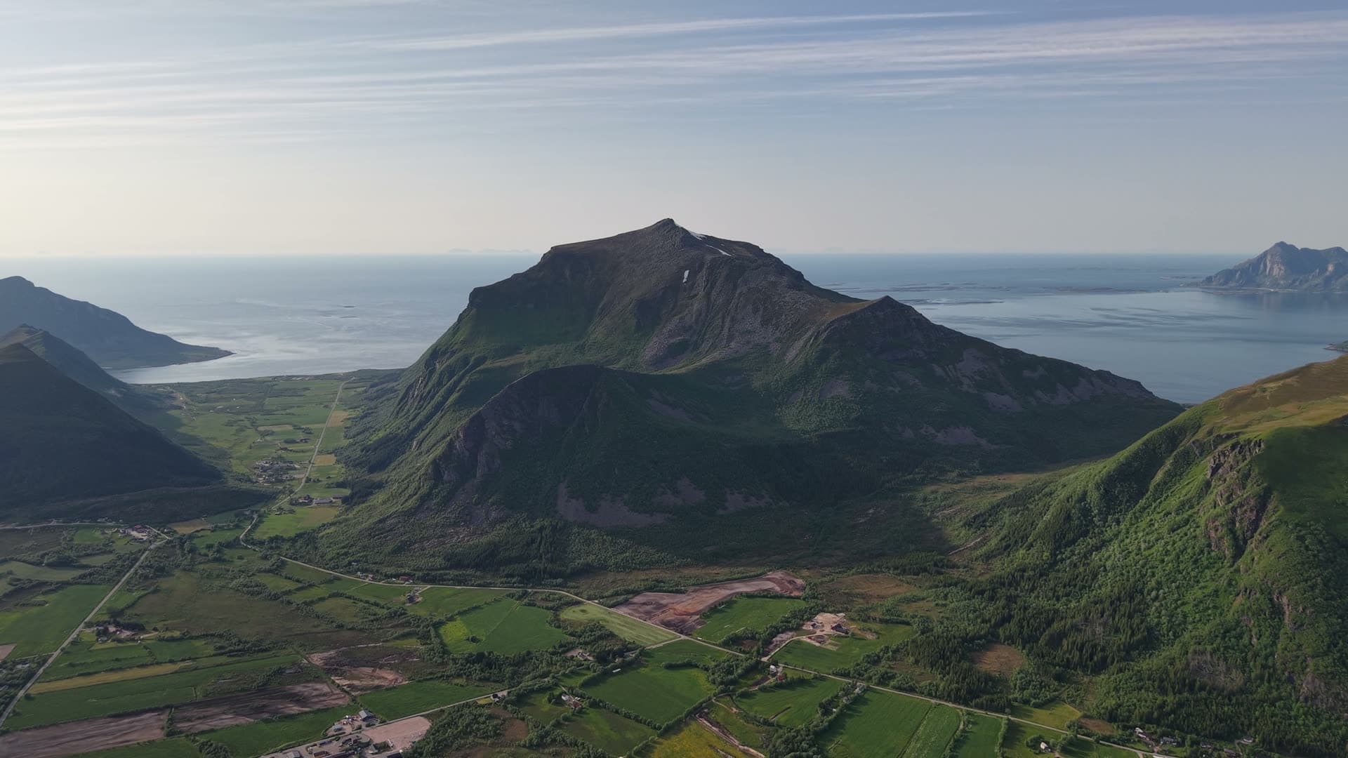 Volcanic mountain above coastal valley, Meløy