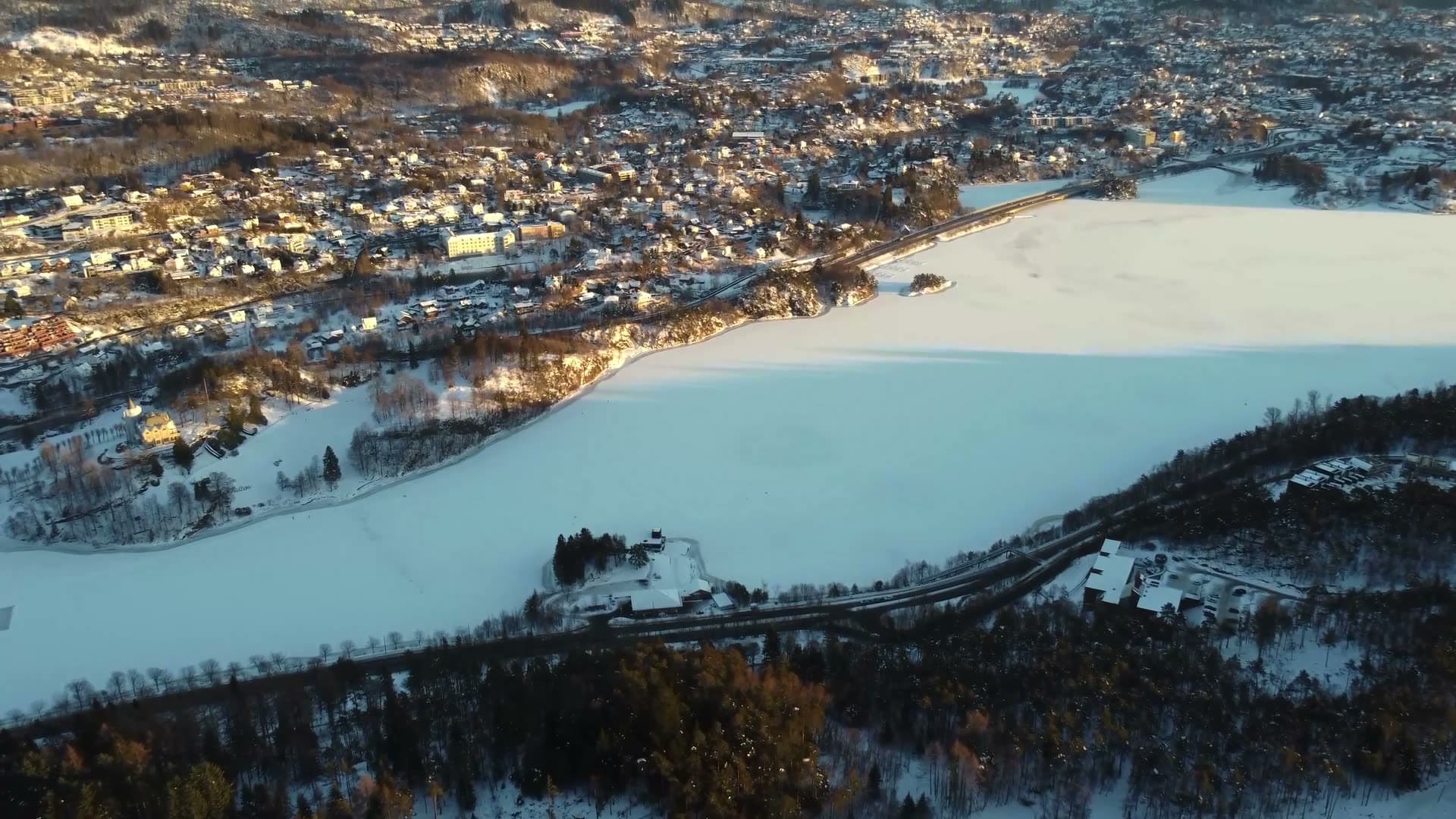 Frozen lake with riverside settlement,Fyllingsdalen