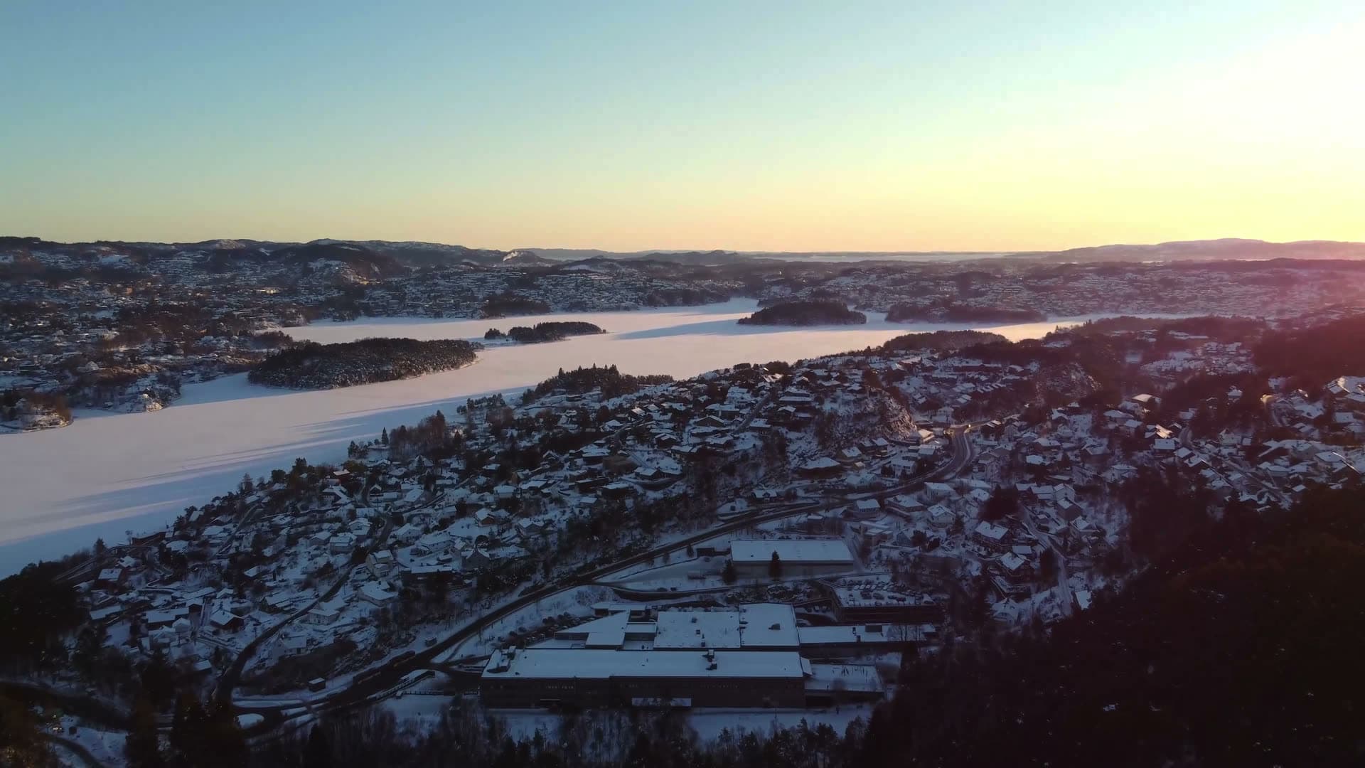 Frozen lakes and snowy hillside settlement, Fyllingsdalen