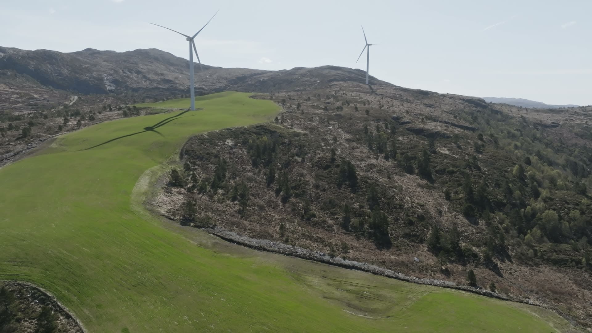 Wind turbines in mountainous valley landscape, Fitjar