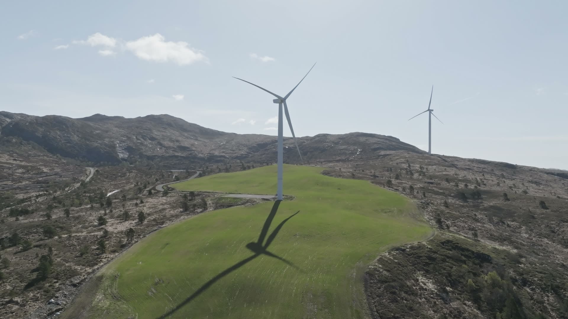 Wind turbines on rolling hillside, Fitjar
