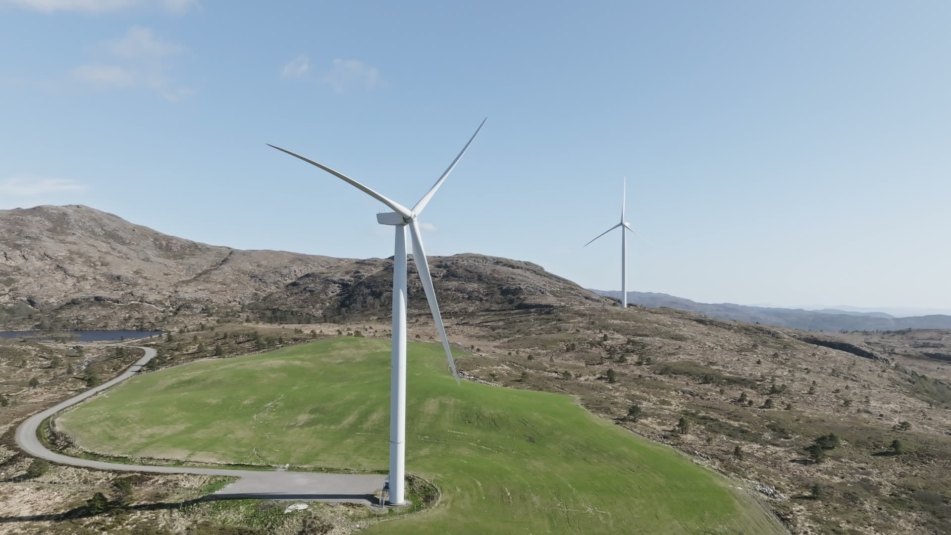 Wind turbines on green hillside, Fitjar