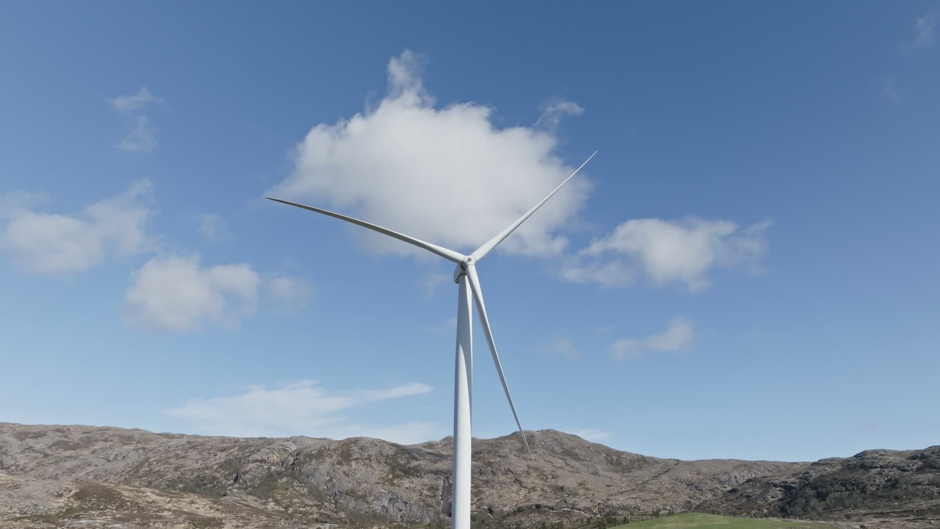 Wind turbine on hillside, Fitjar