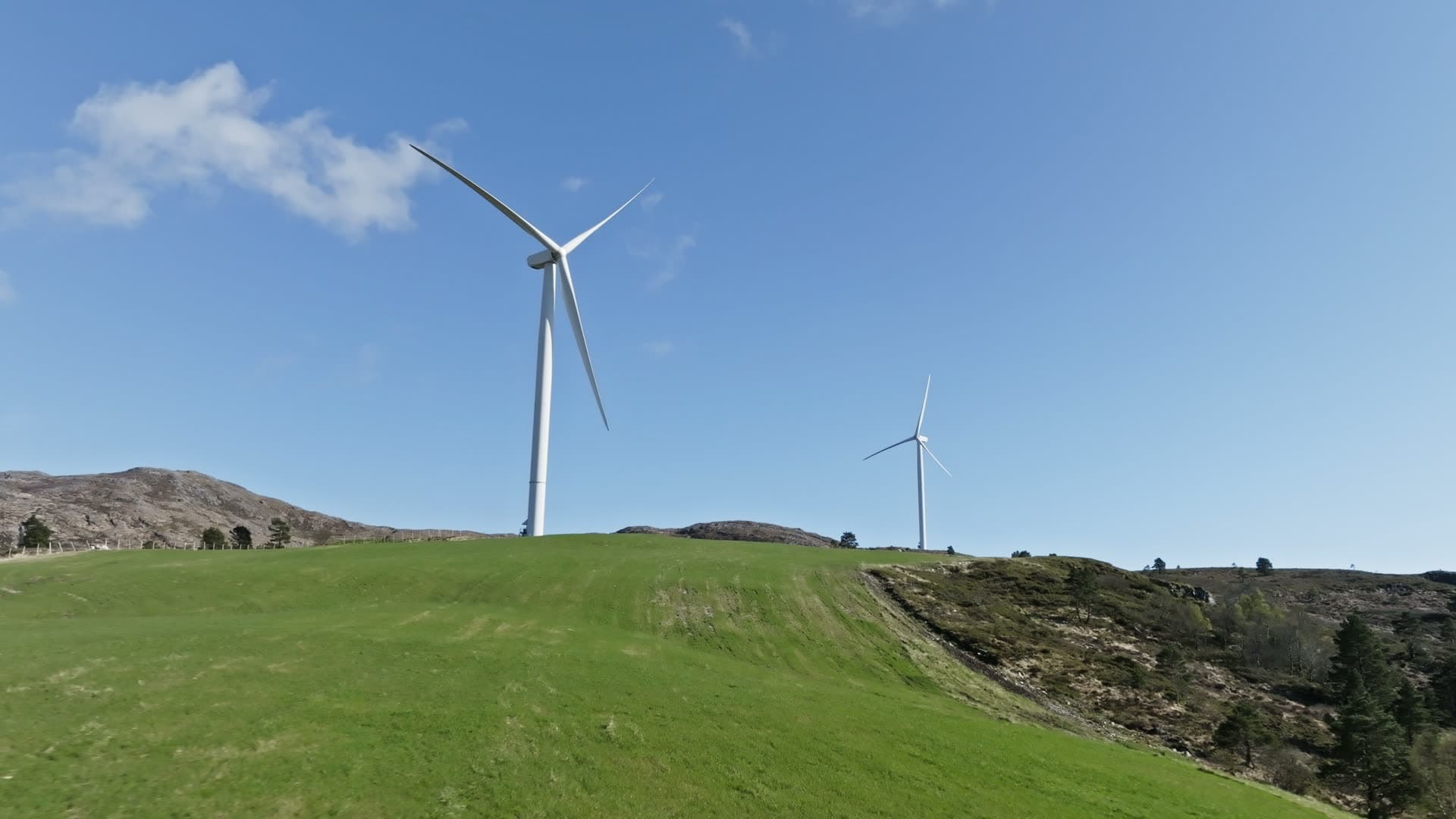 Wind turbines on rolling hillside, Fitjar