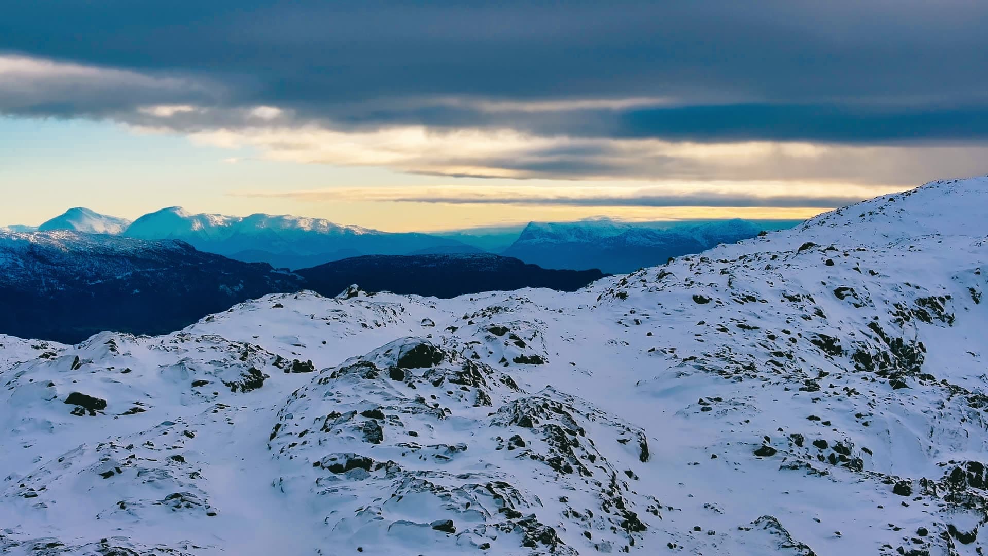 Snowy mountains at dusk with rocky ridges, Bergen