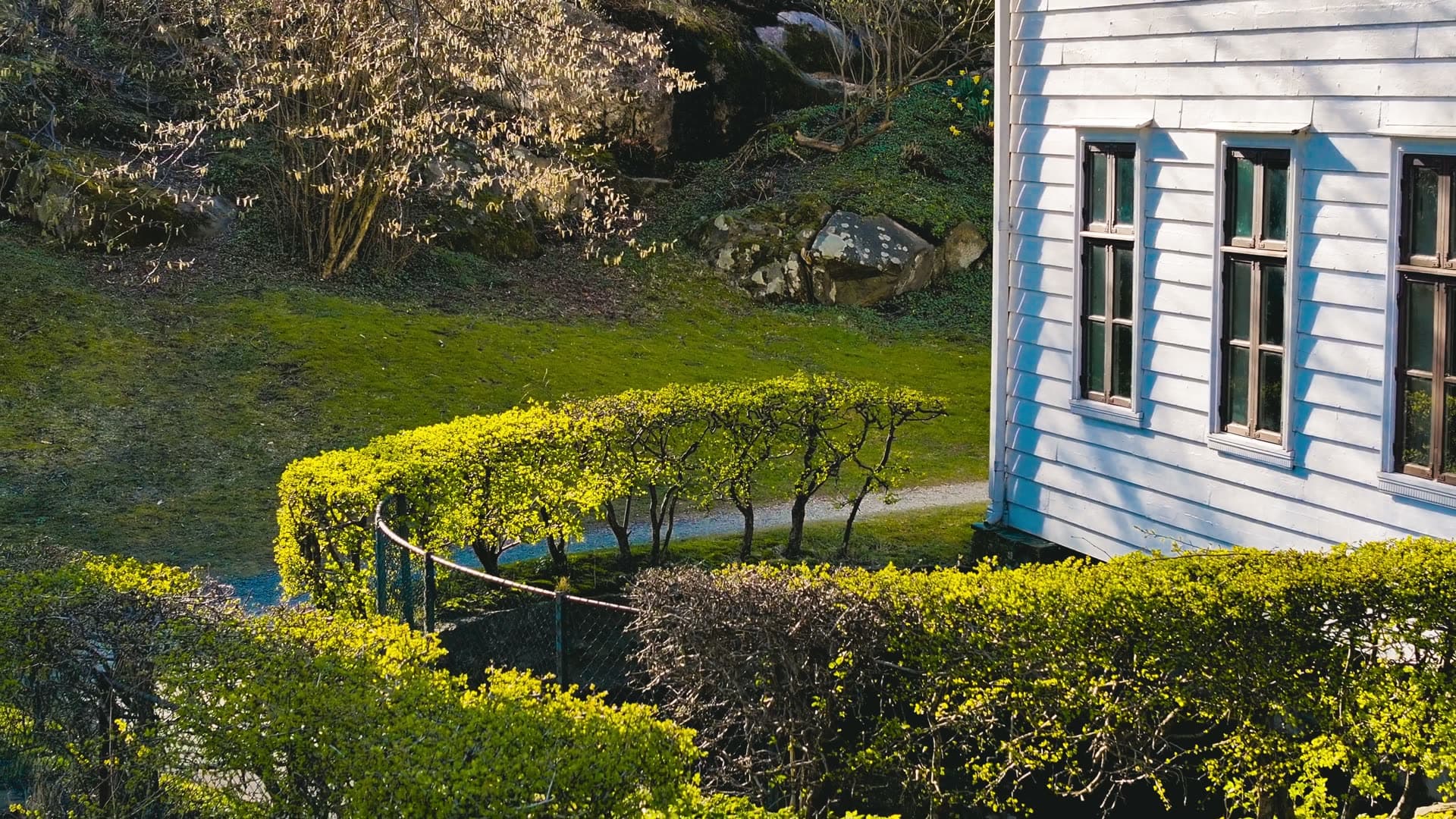 Blue and white cottage with flowering garden, Bergen
