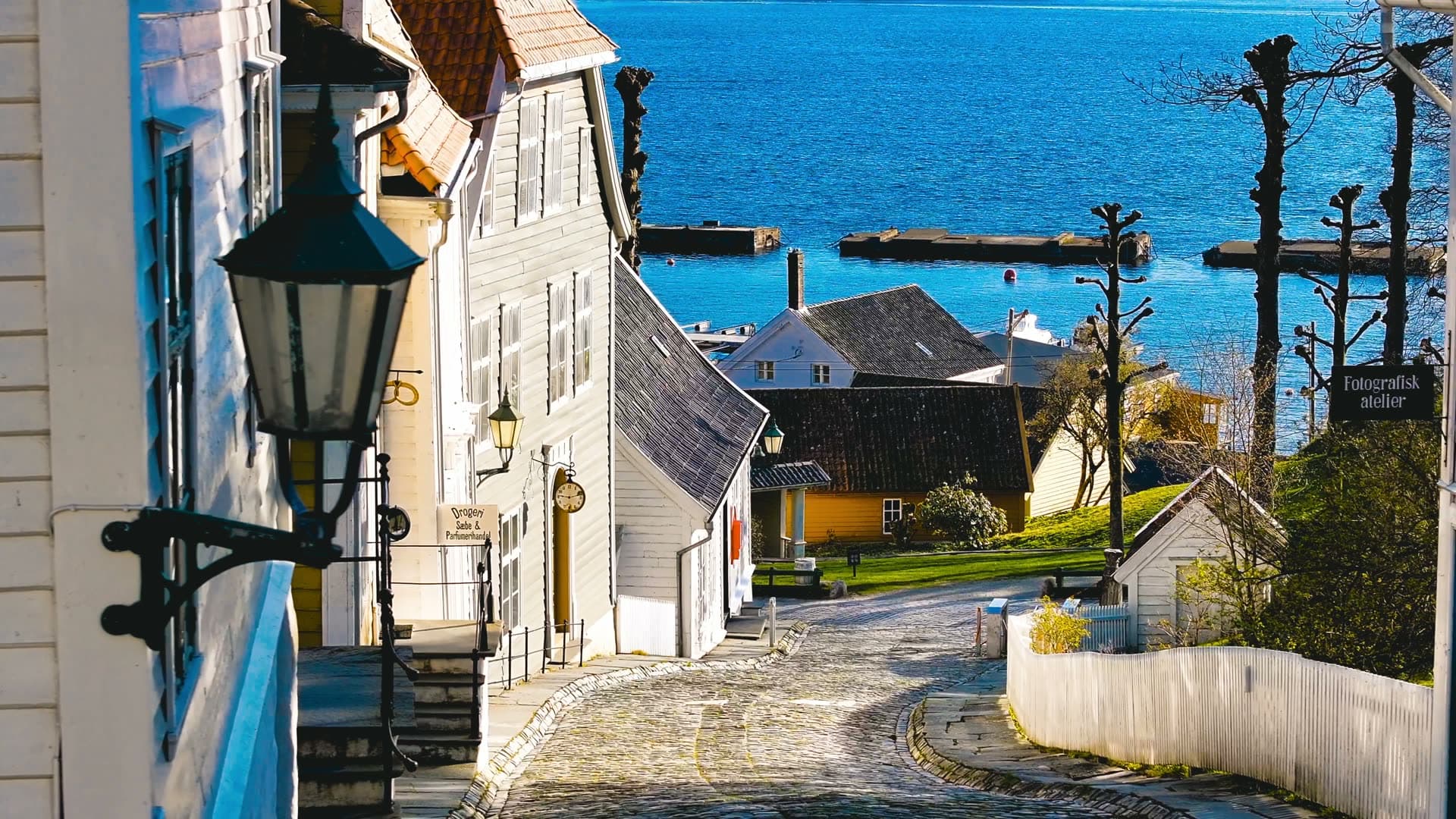 White wooden houses cobblestone street fjord, Bergen