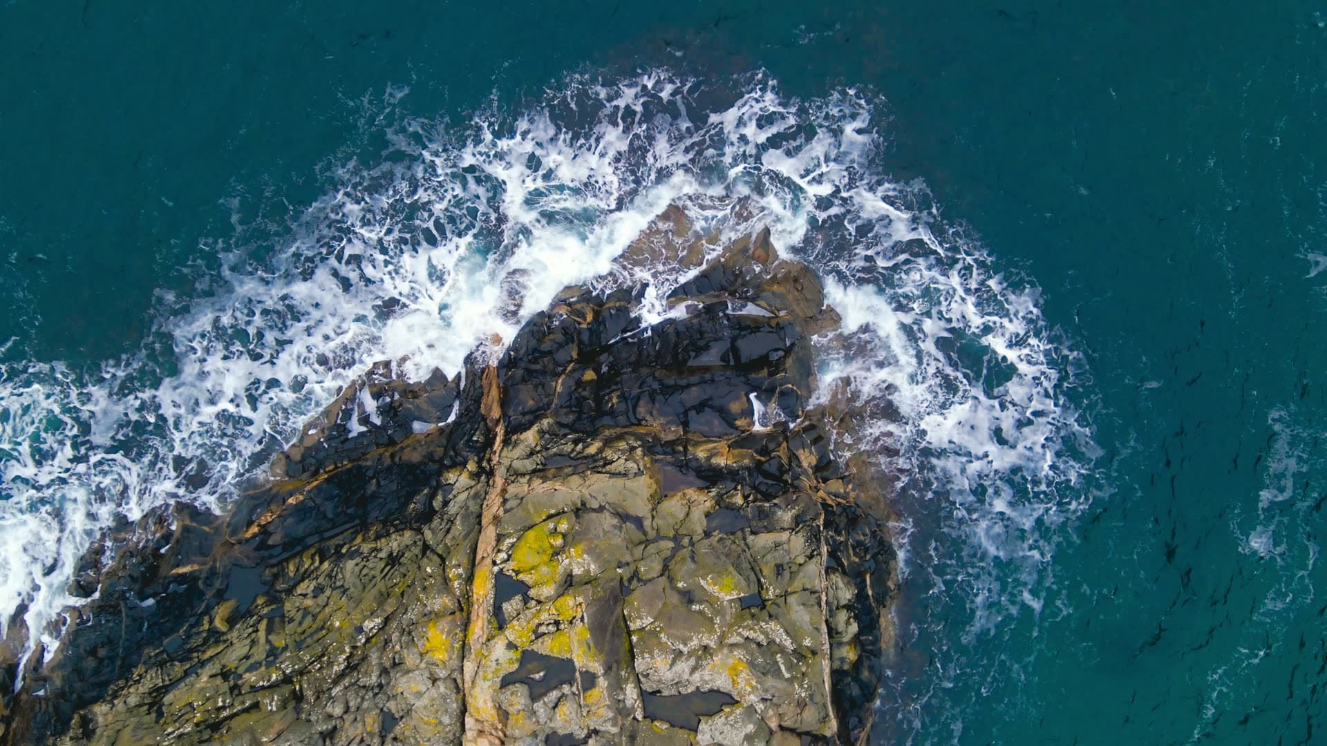 Rocky coastal outcrop with crashing waves, Bergen