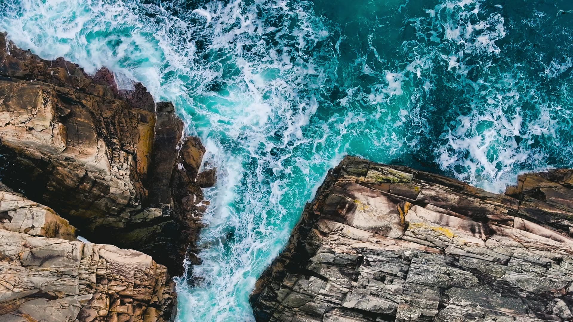 Waves crashing rocky coastal cliffs, Bergen