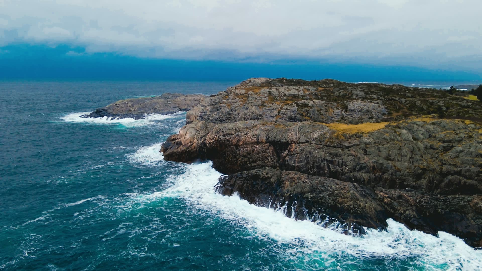 Rocky coastline with crashing waves, Bergen