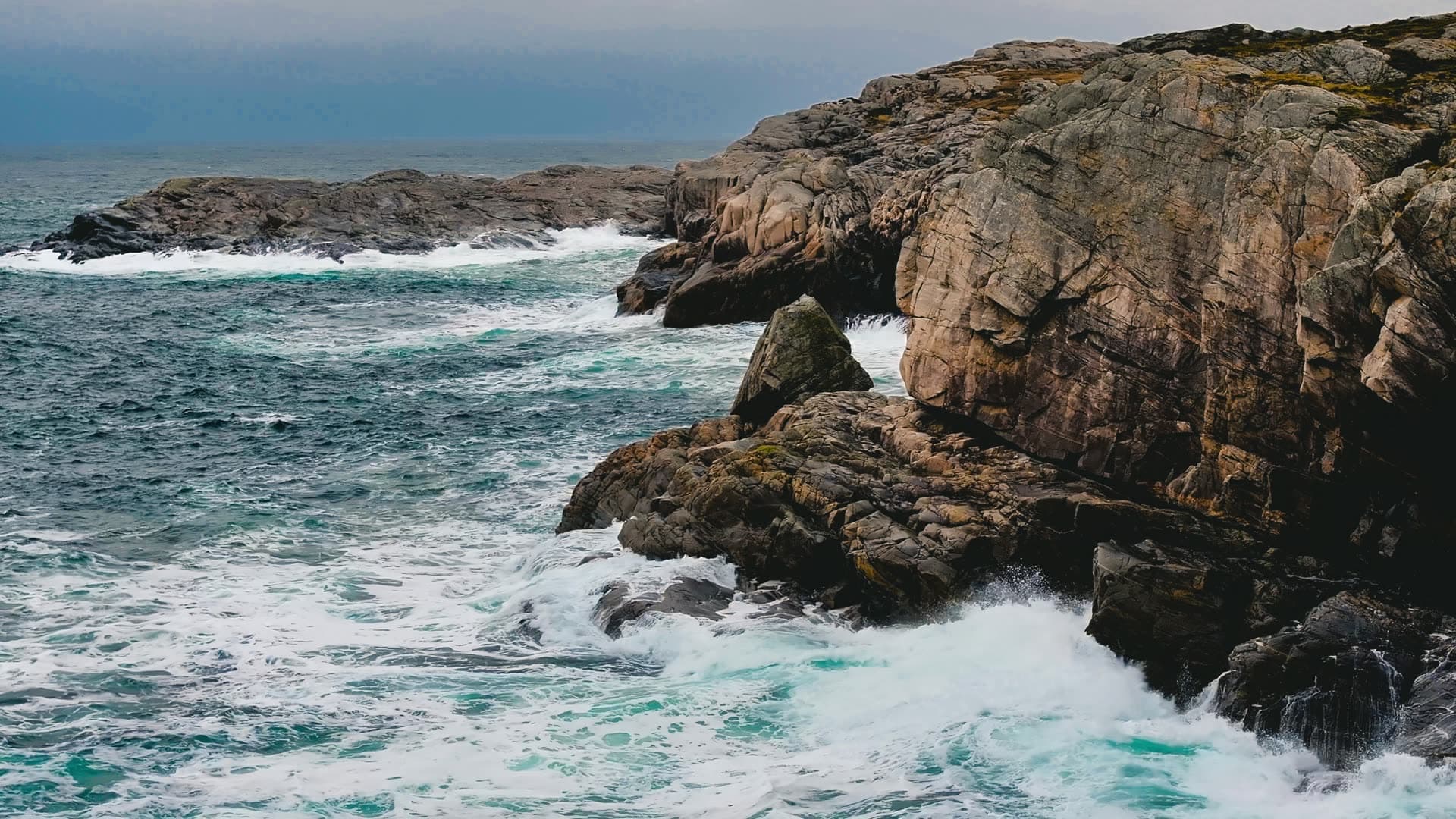 Rocky coastline with crashing waves, Bergen