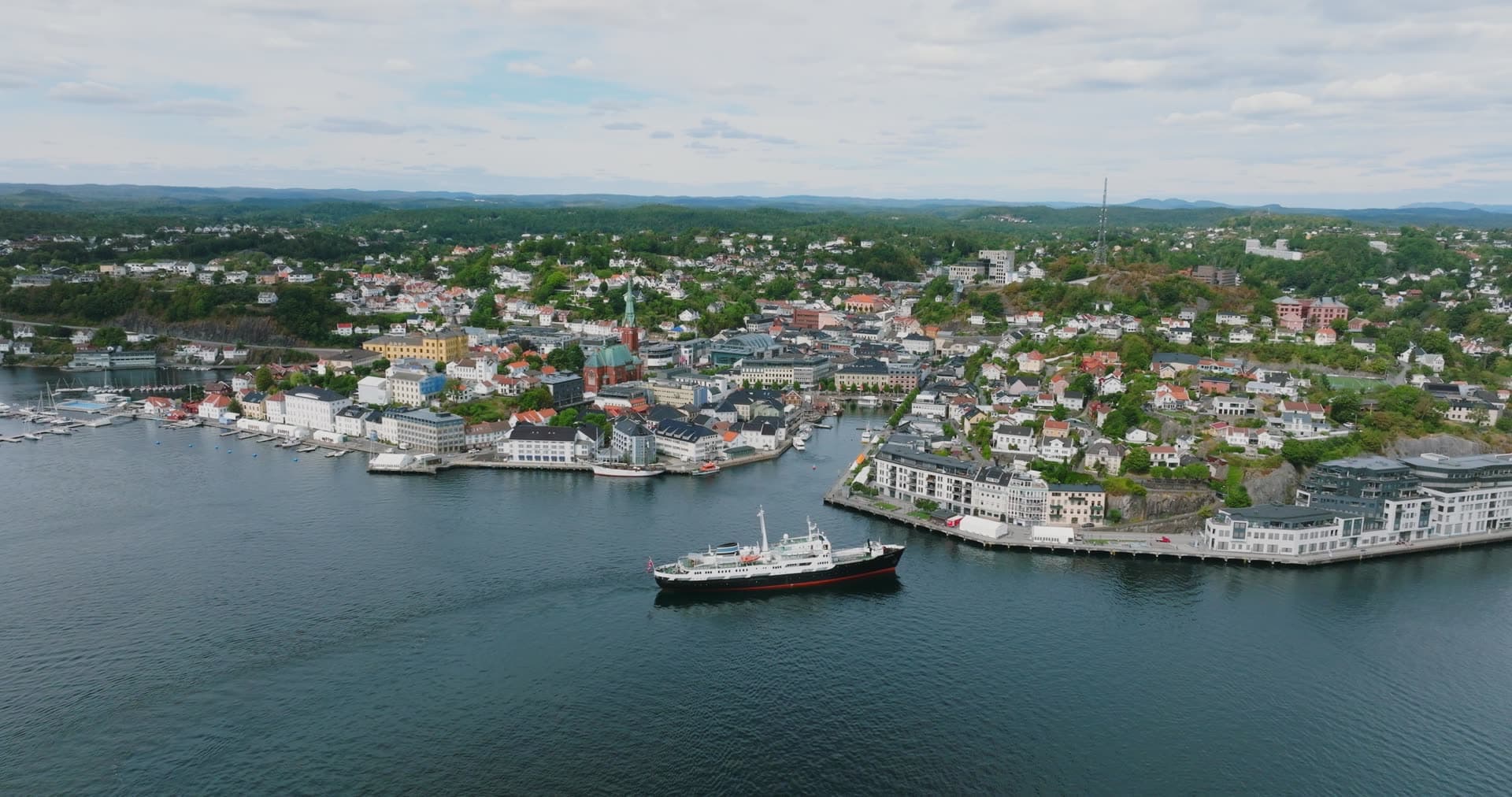 Coastal steamer leaving the harbour quay, Arendal, Norway
