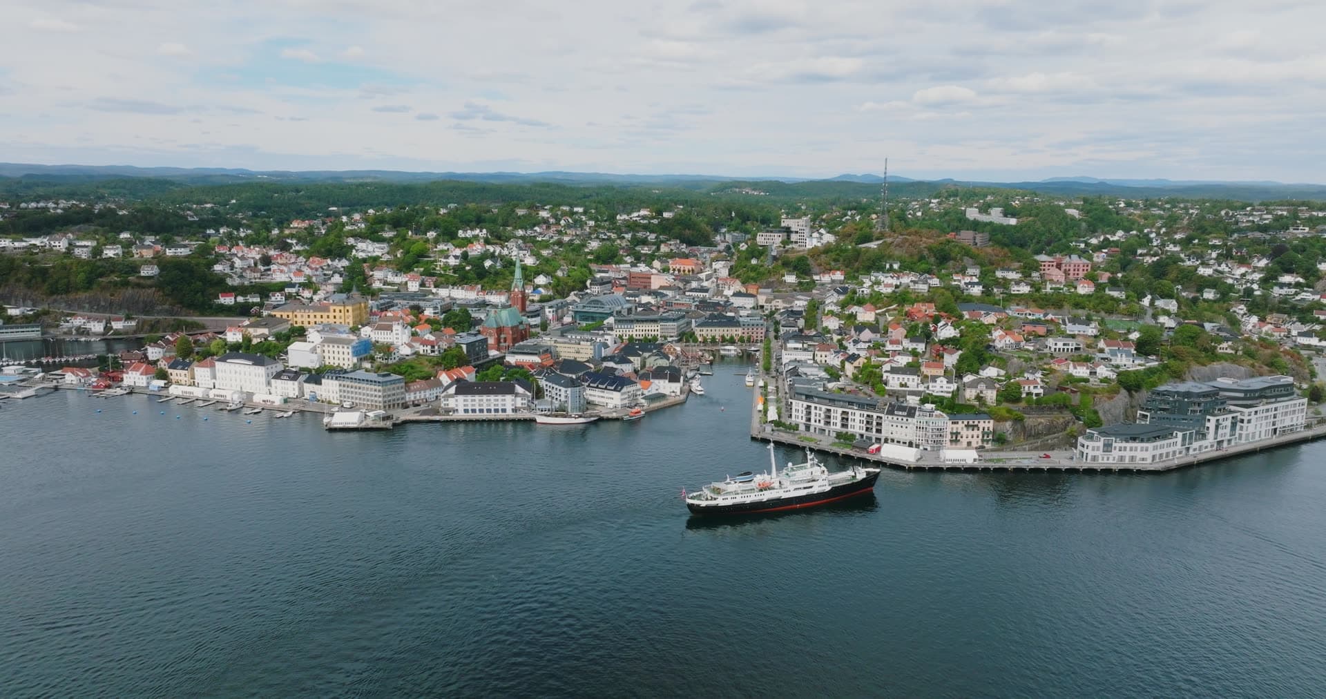 Passenger ship leaving the harbour quay, Arendal, Norway