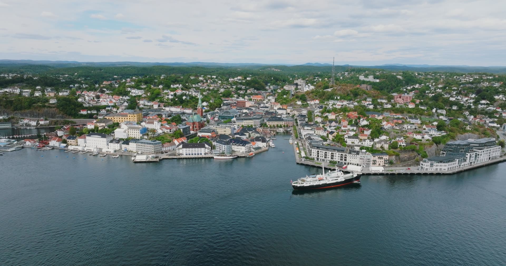 Black-hulled steamer moored at town quay, Arendal, Norway