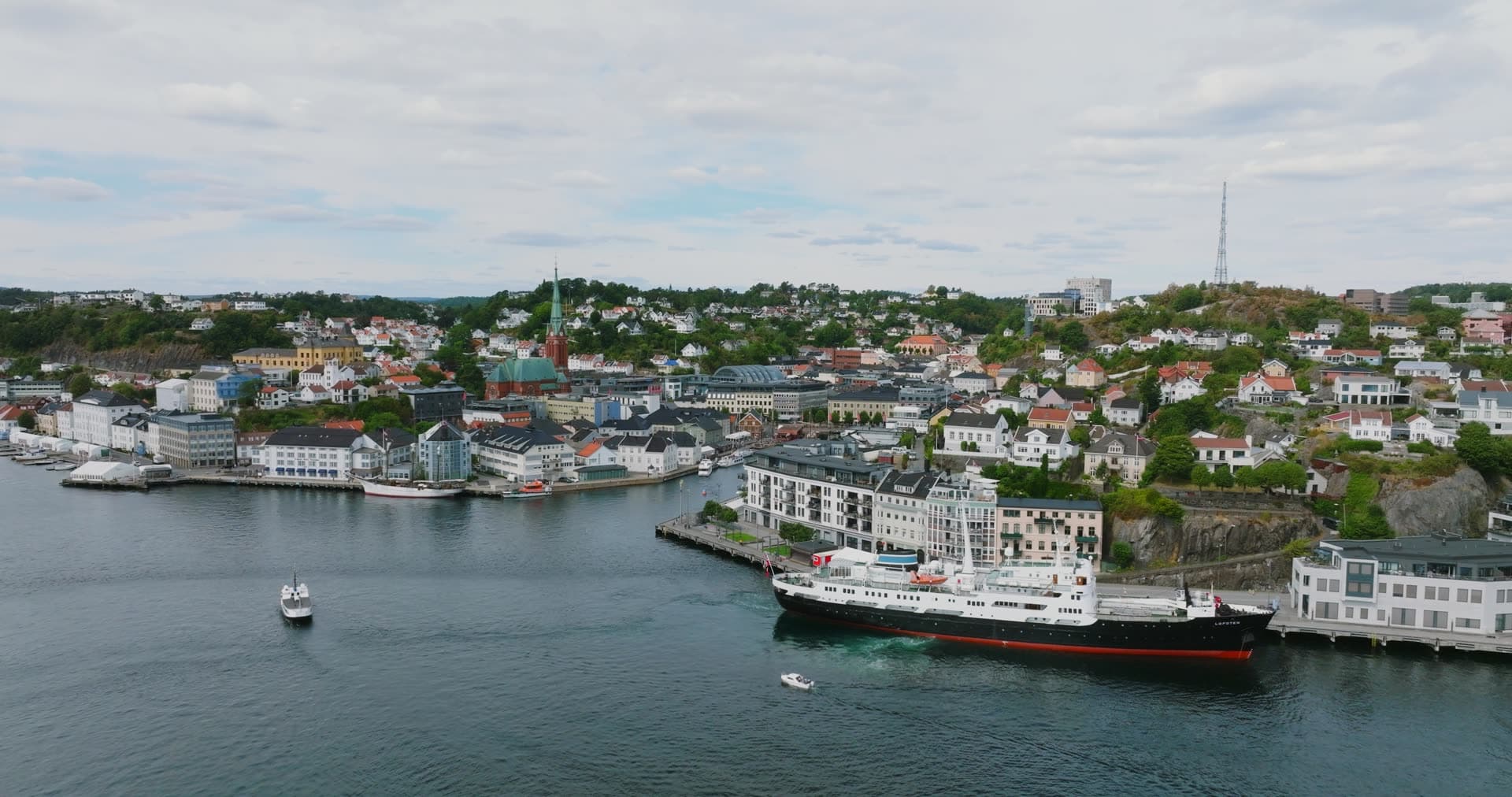 Black-hulled coastal steamer docked at quay, Arendal, Norway