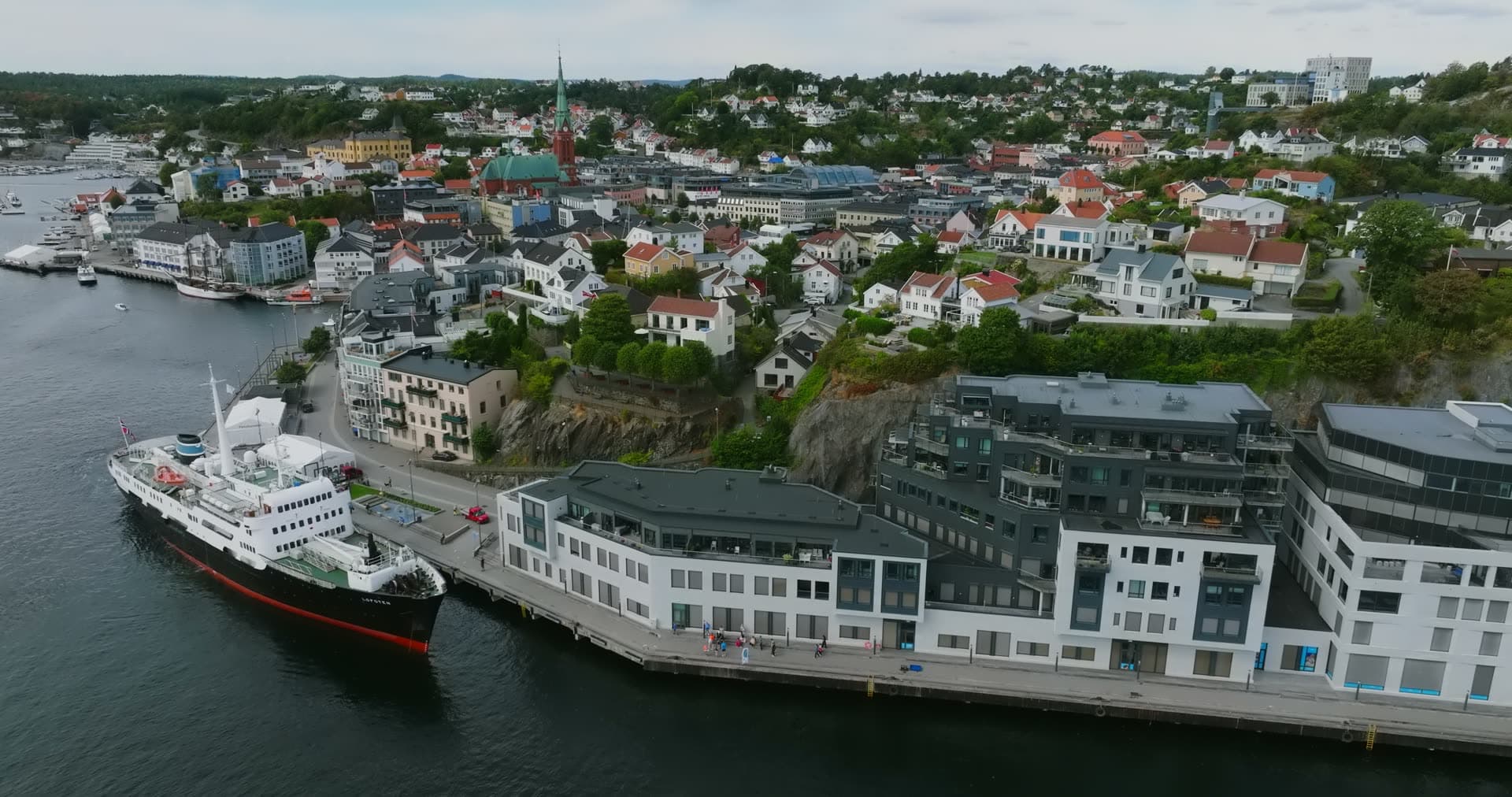 Black-hulled coastal steamer moored at quay, Arendal, Norway