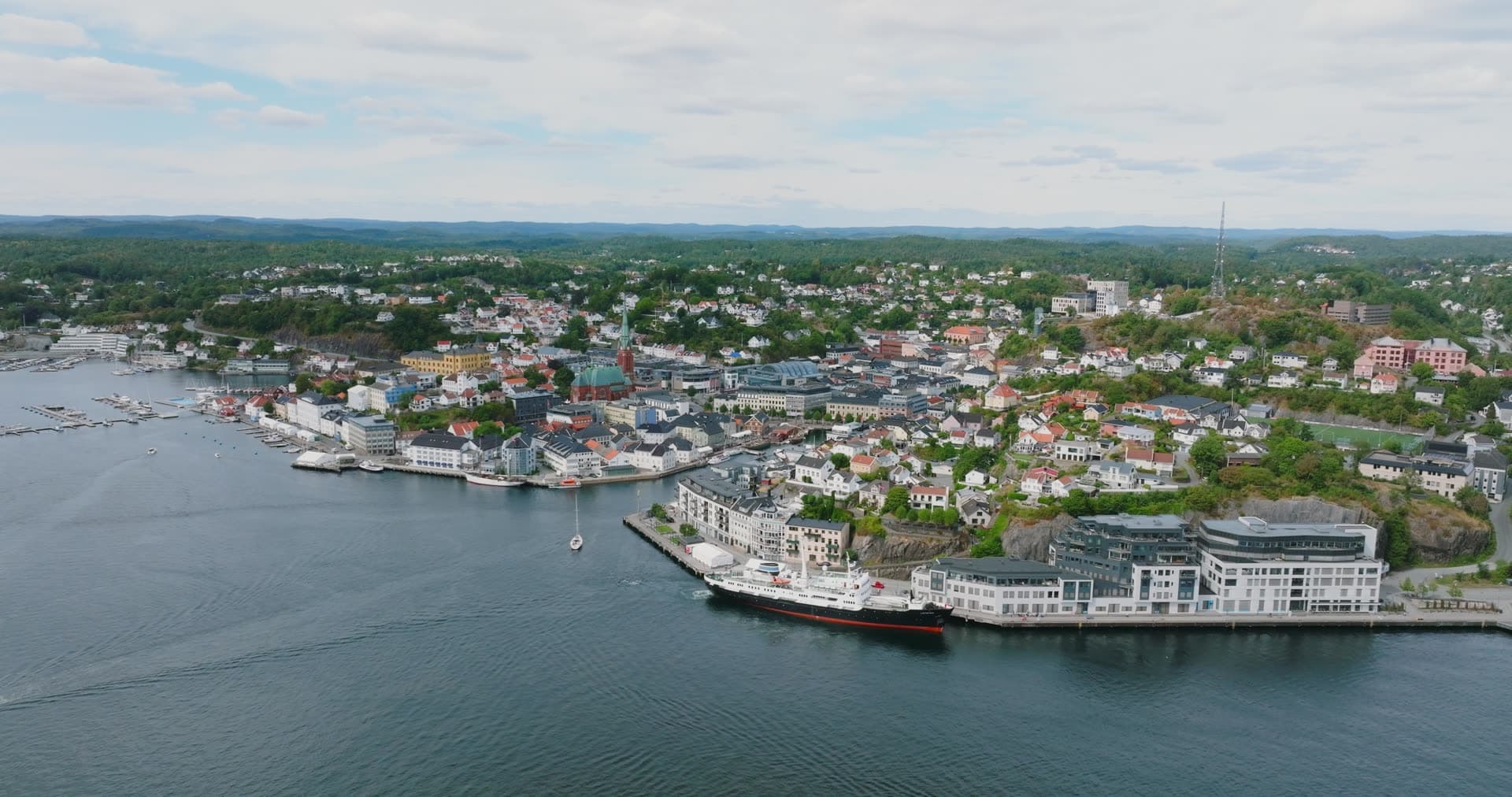Black-hulled ship moored at the town quay, Arendal, Norway