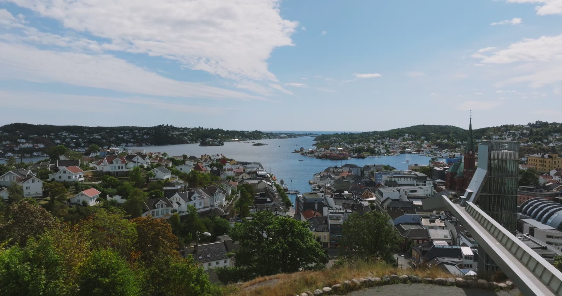 Hilltop glass elevator tower above town and harbor, Arendal, Norway