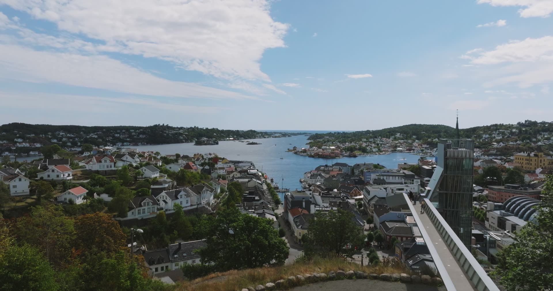 Glass tower and church spire over the harbour, Arendal, Norway