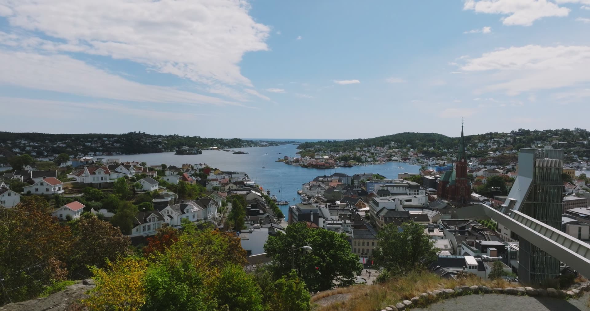 Church spire and glass tower above the harbour, Arendal, Norway
