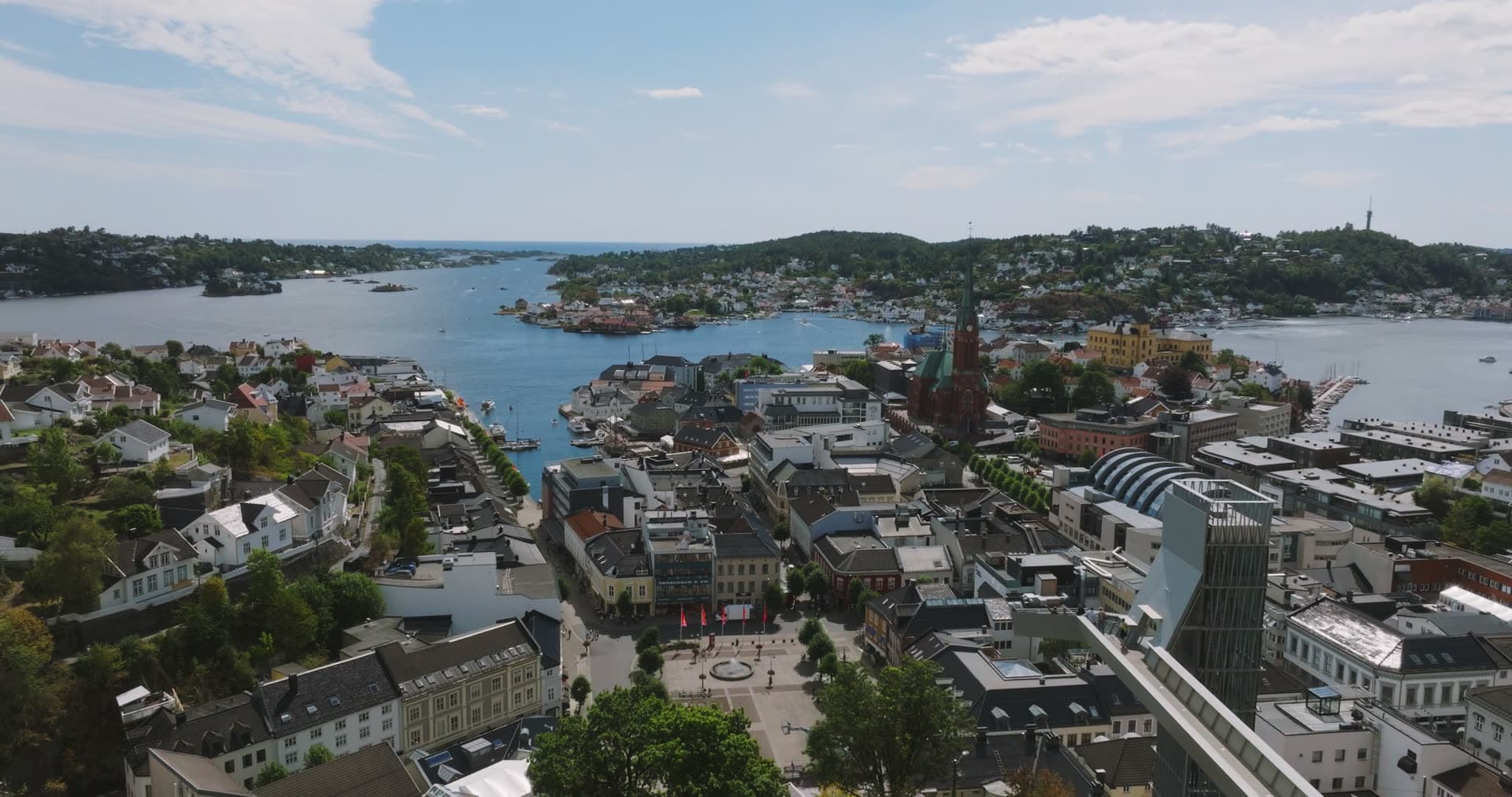 Town square and church spire above the harbour, Arendal, Norway
