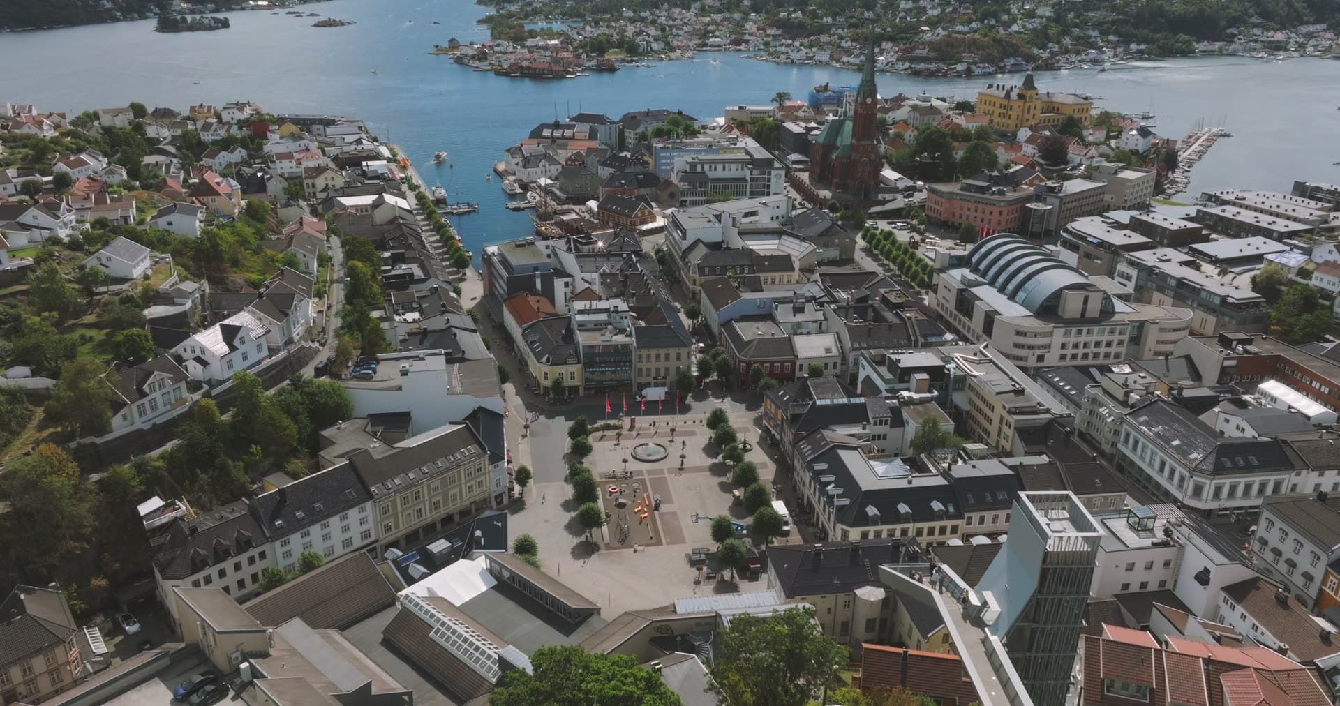 Town square and church spire above the harbour, Arendal, Norway