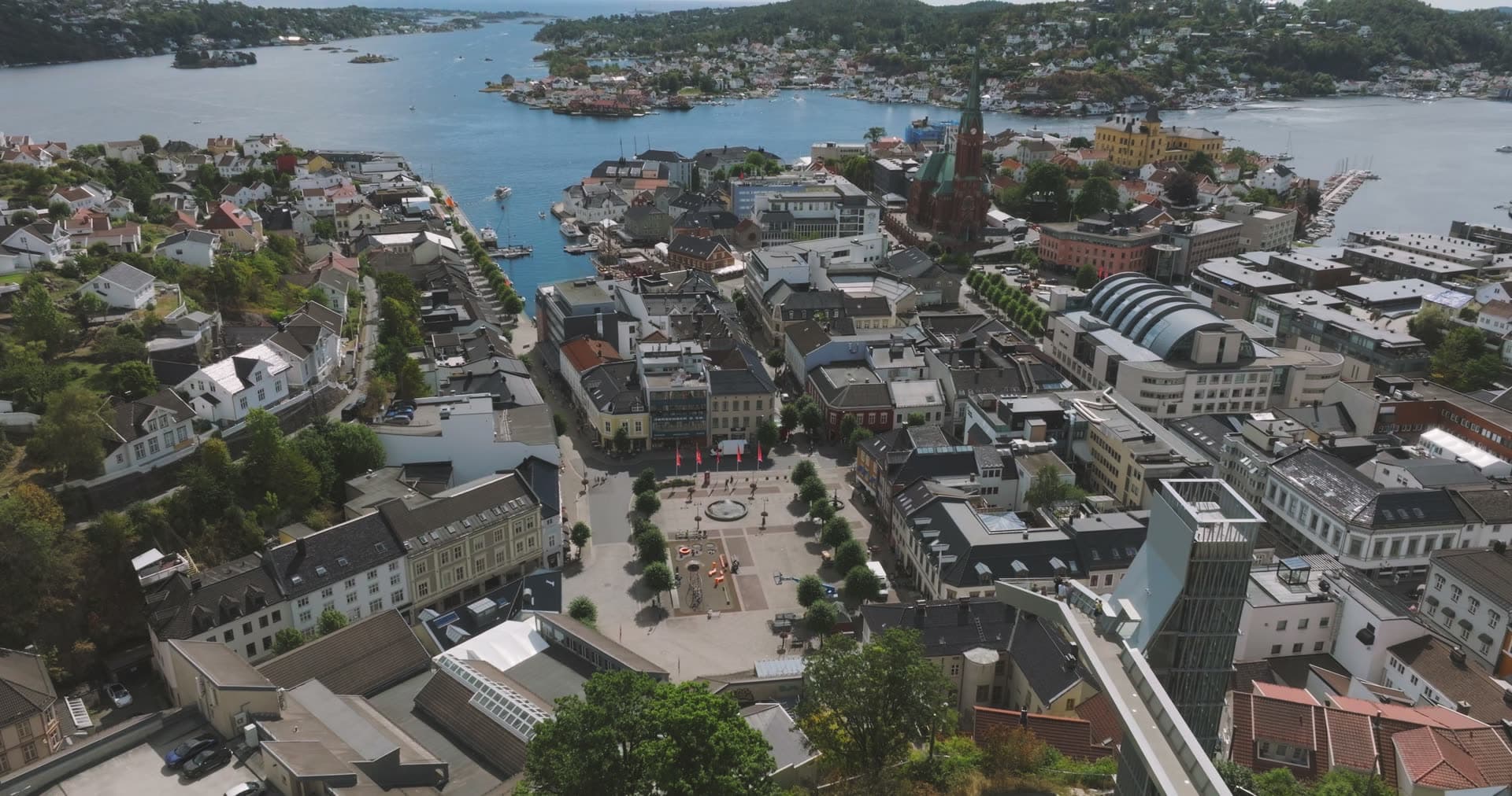 Town square, church spire and harbour, Arendal, Norway