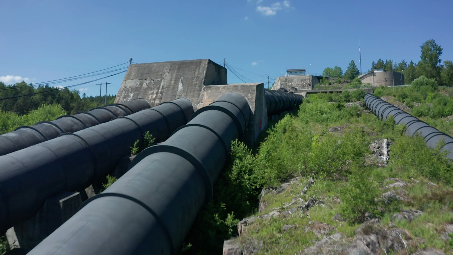 Hydro penstock pipes climbing rocky hill, Bøylefoss, Norway