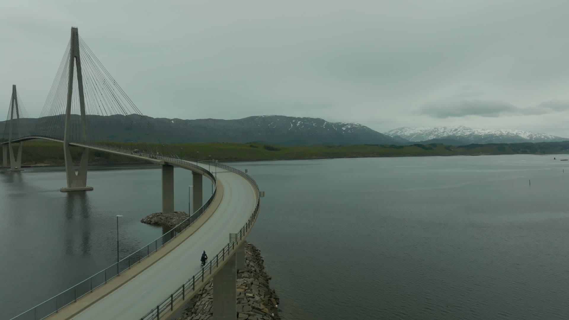 Curving cable-stayed bridge on rock causeway, Helgelandsbrua, Norway