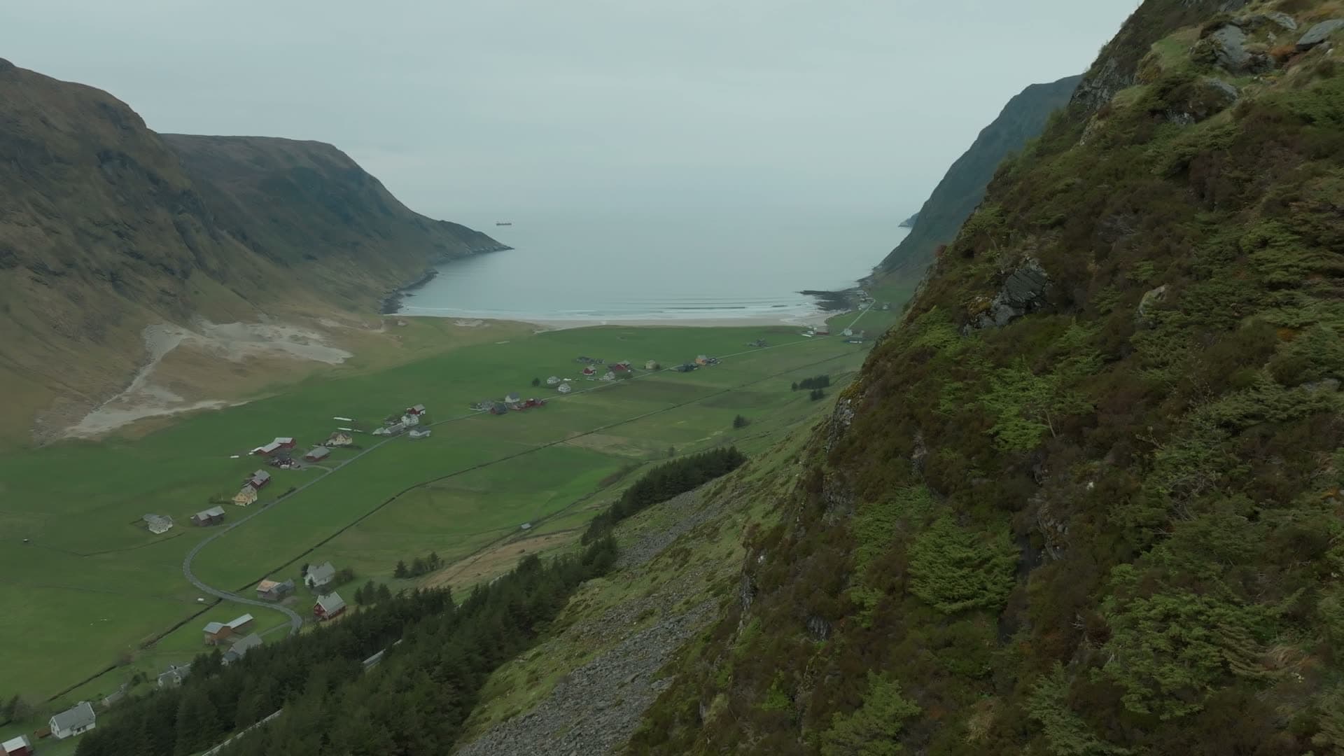 Cliff reveal of farm valley and sand beach, Hoddevik, Norway