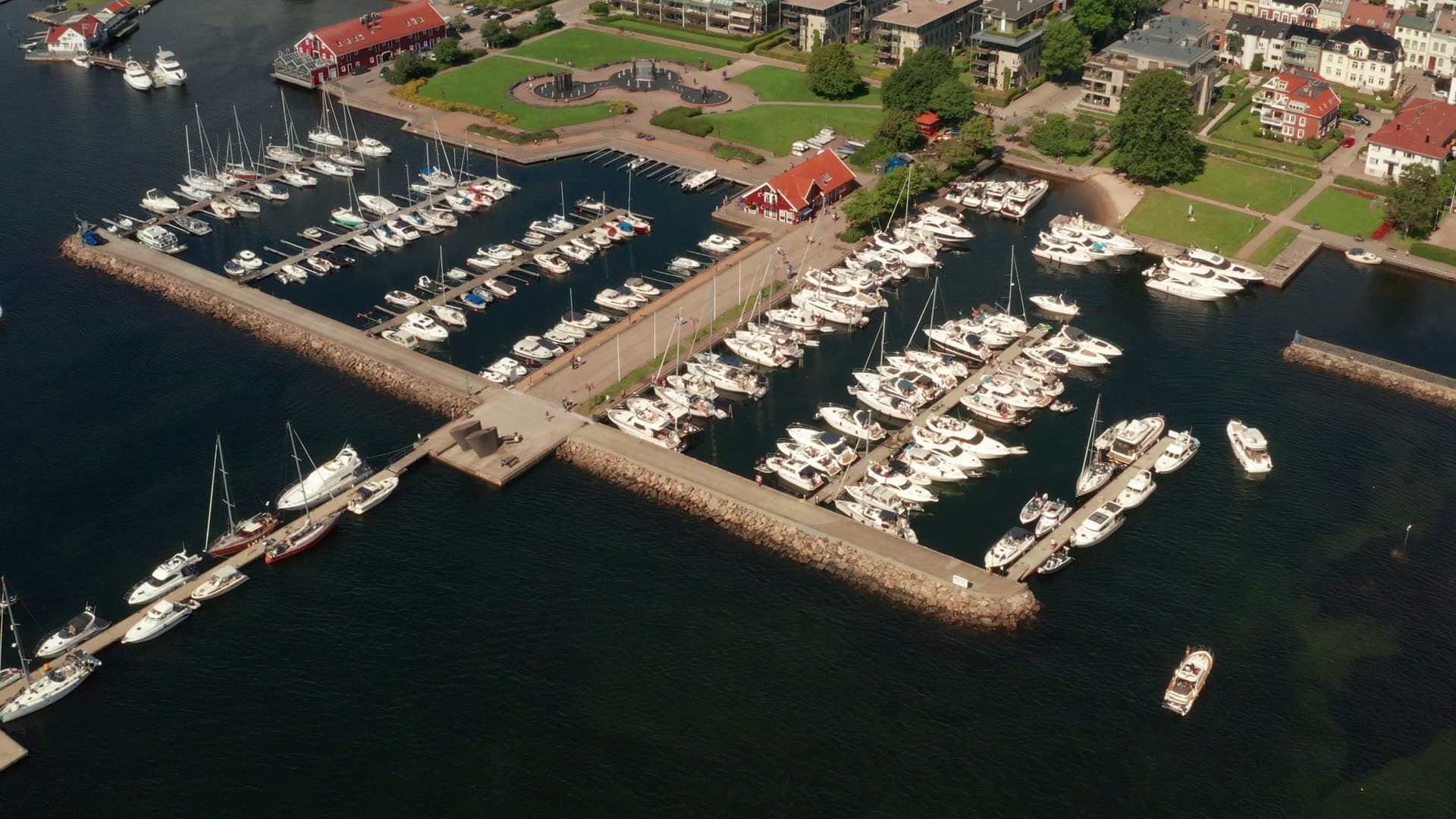 Marina behind rock breakwater, town park, Kristiansand, Norway