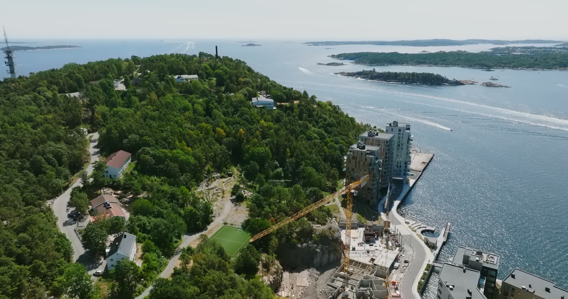 Apartment tower rising on the wooded headland, Kristiansand, Norway