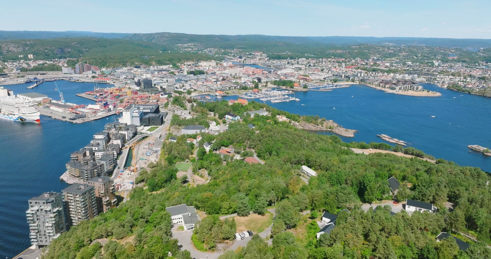 Container cranes and cruise ship at the quay, Kristiansand, Norway
