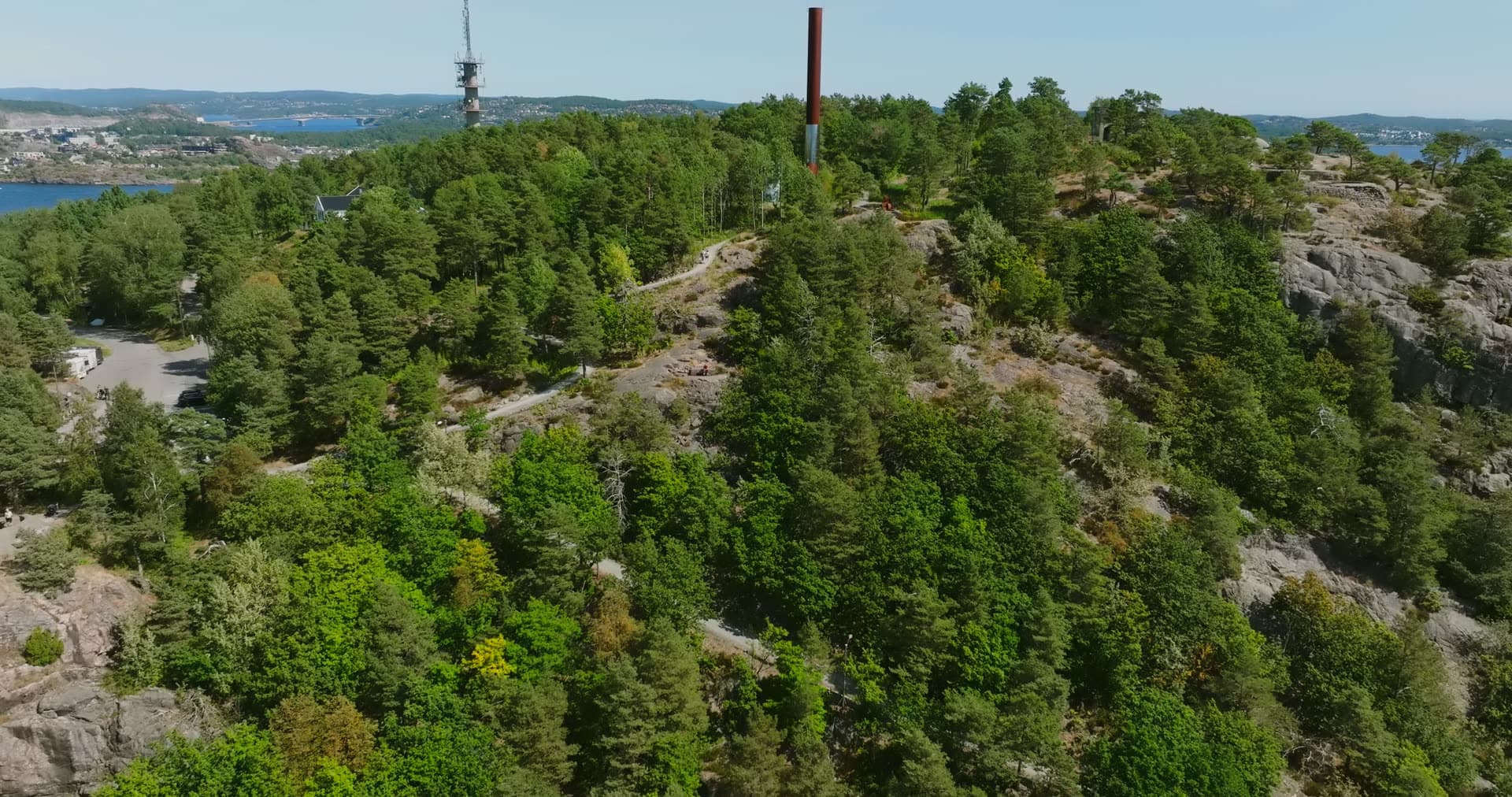 Lattice mast and red column on the pine ridge, Kristiansand, Norway
