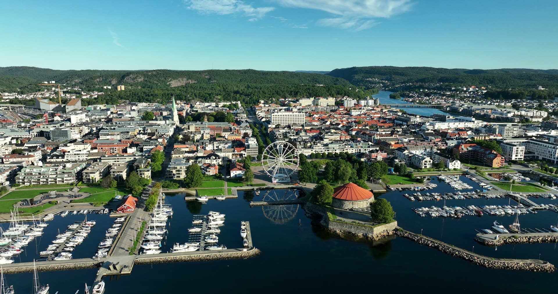 Ferris wheel and round stone fort by marina, Kristiansand, Norway