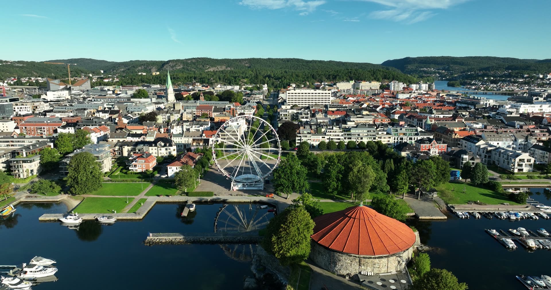 Ferris wheel and round fortress by marina, Kristiansand, Norway