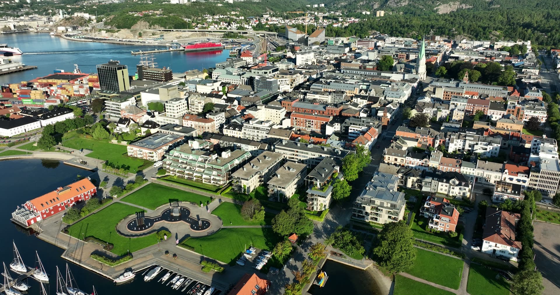 Marina and park headland beside city grid, Kristiansand, Norway