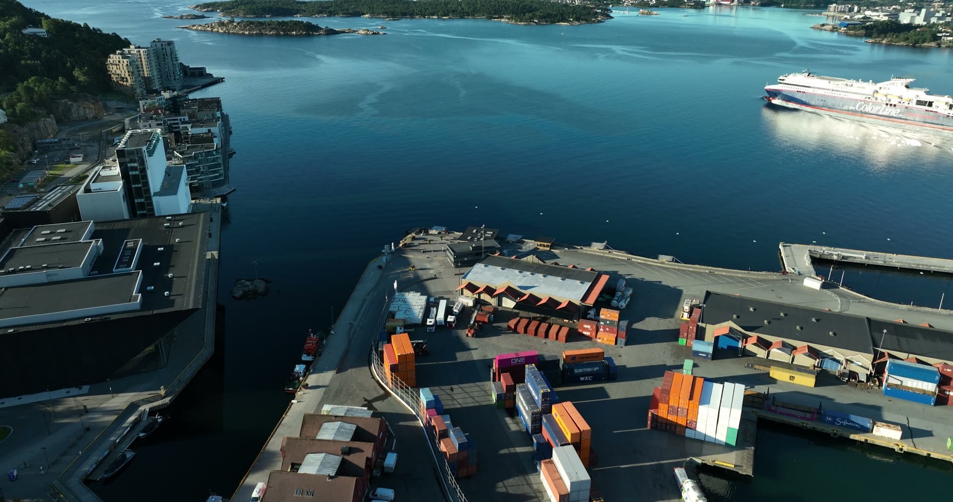 Ferry departing past container quay, Kristiansand, Norway