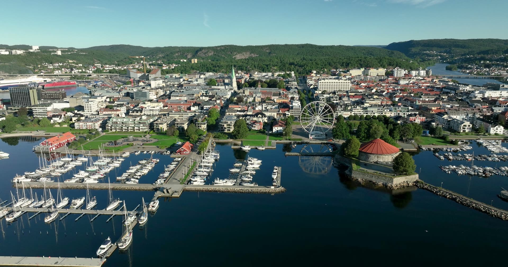 Ferris wheel and marina by red-roofed rotunda, Kristiansand, Norway