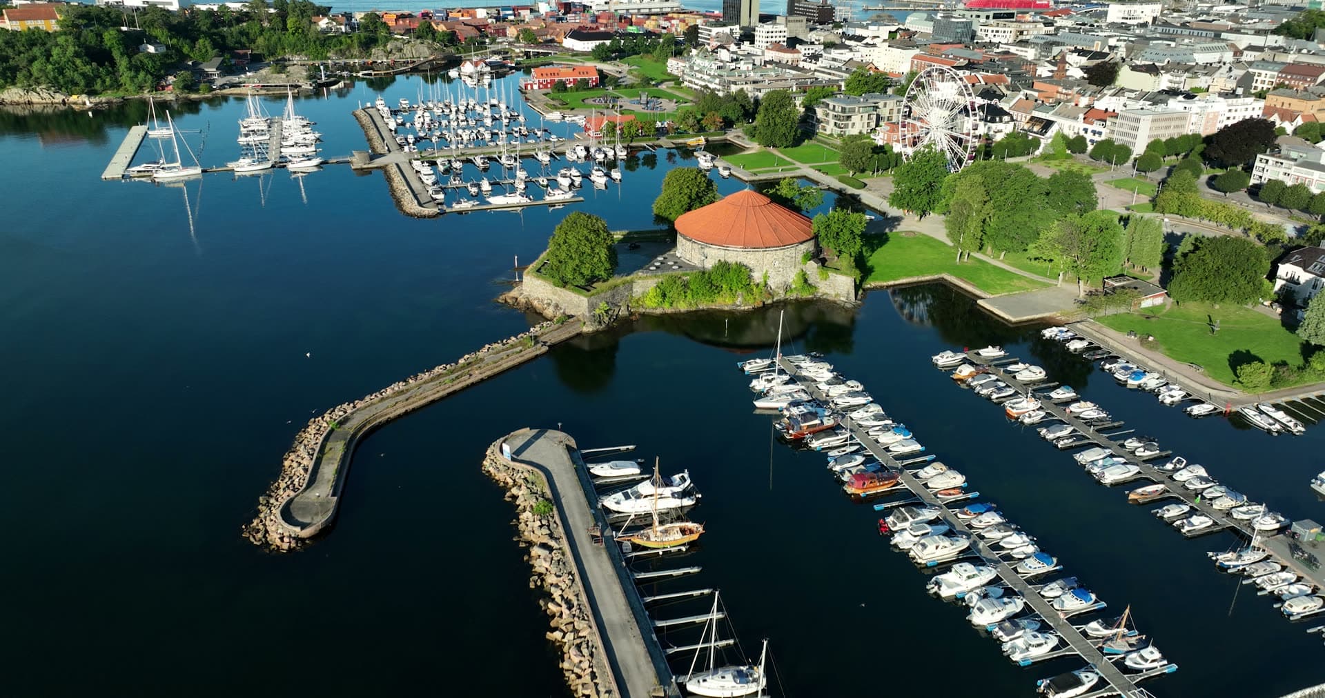Round stone fortress by marina and Ferris wheel, Kristiansand, Norway