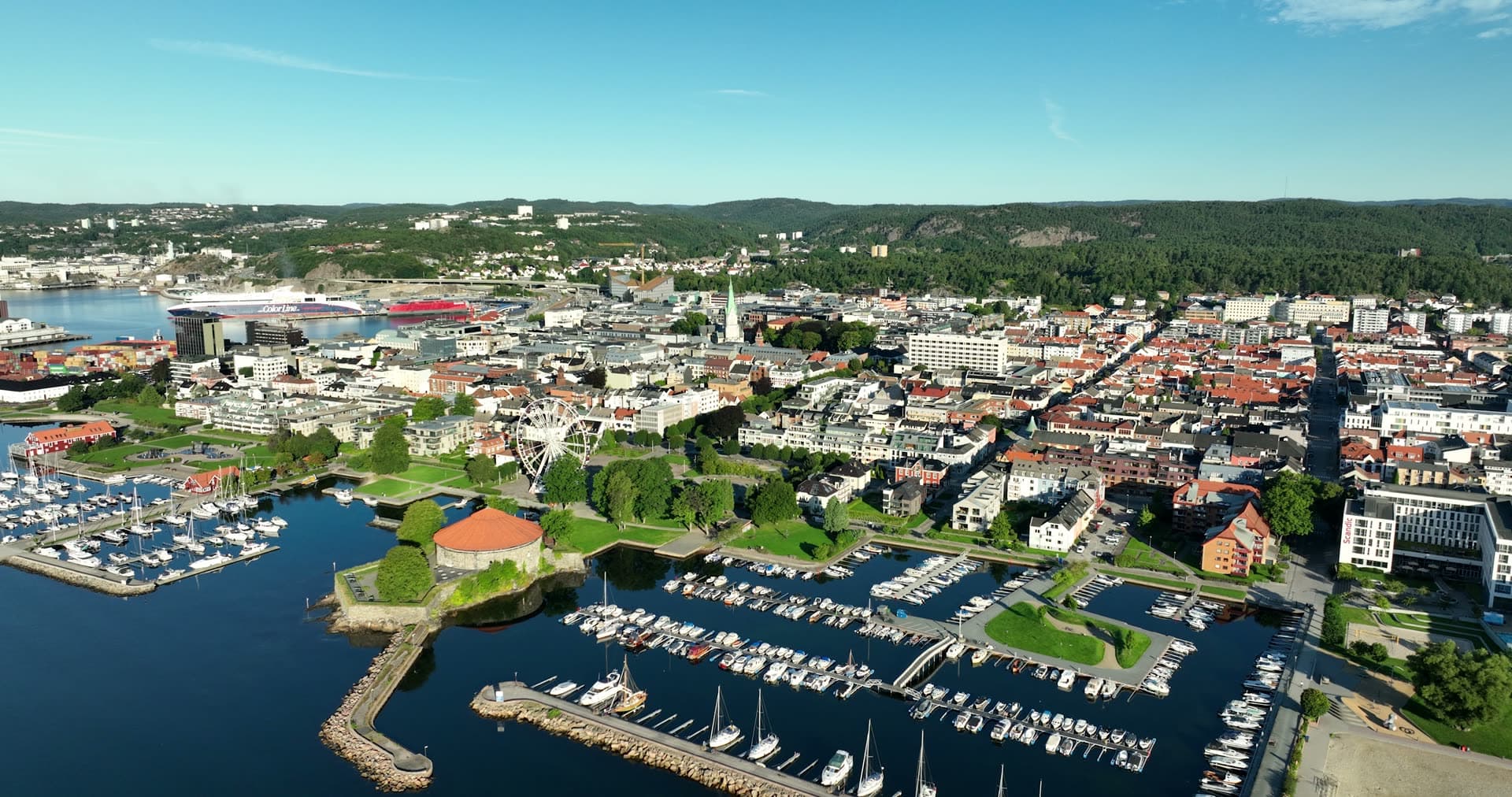 Round fortress and marina by ferris wheel, Kristiansand, Norway