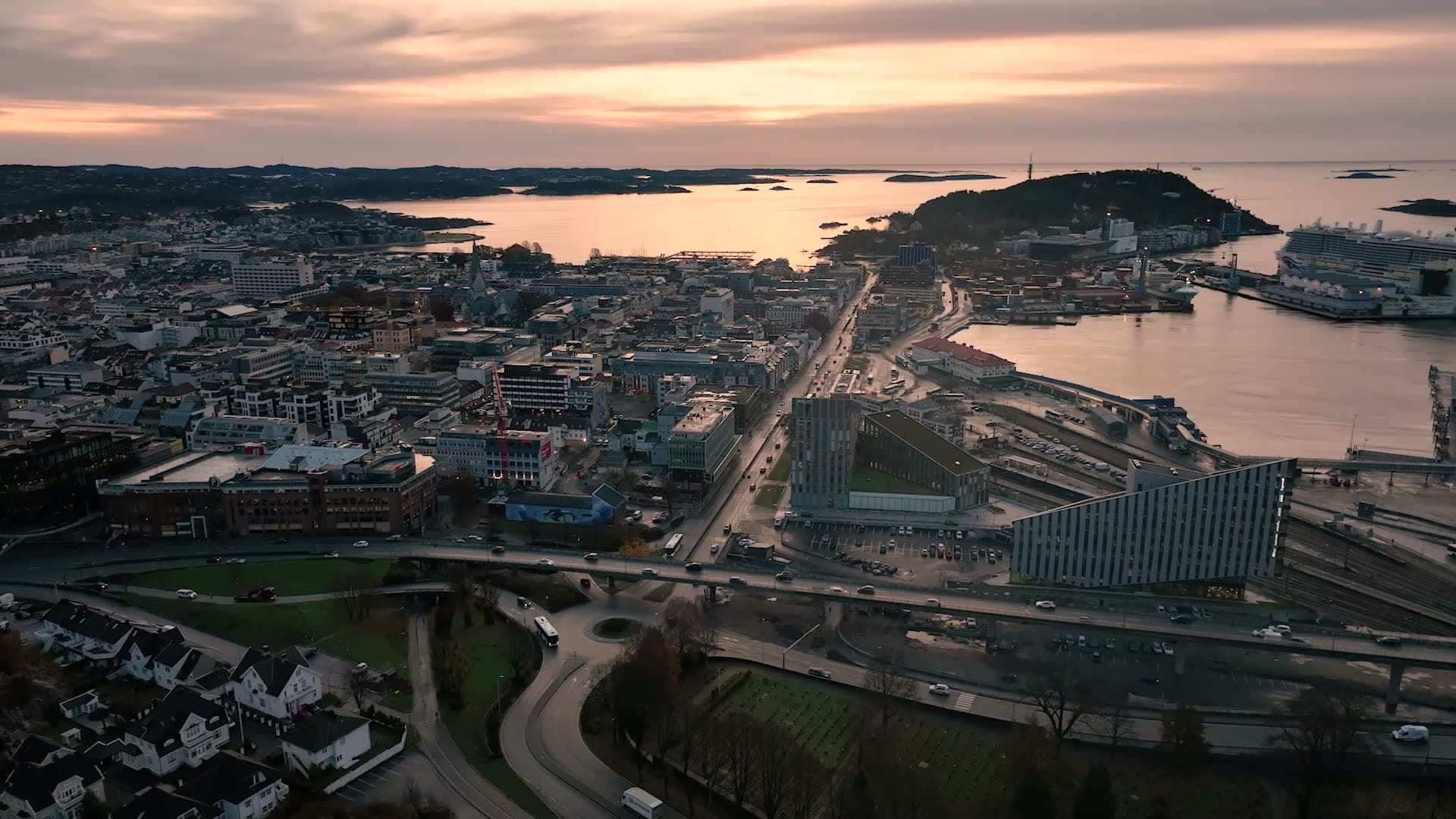 Cruise ship at quay past city rail yard, Kristiansand, Norway