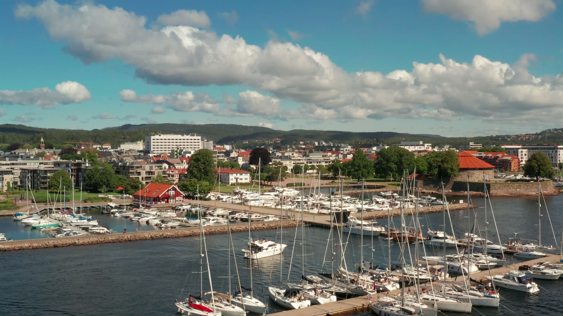 Marina breakwater and moored sailboats, Kristiansand, Norway