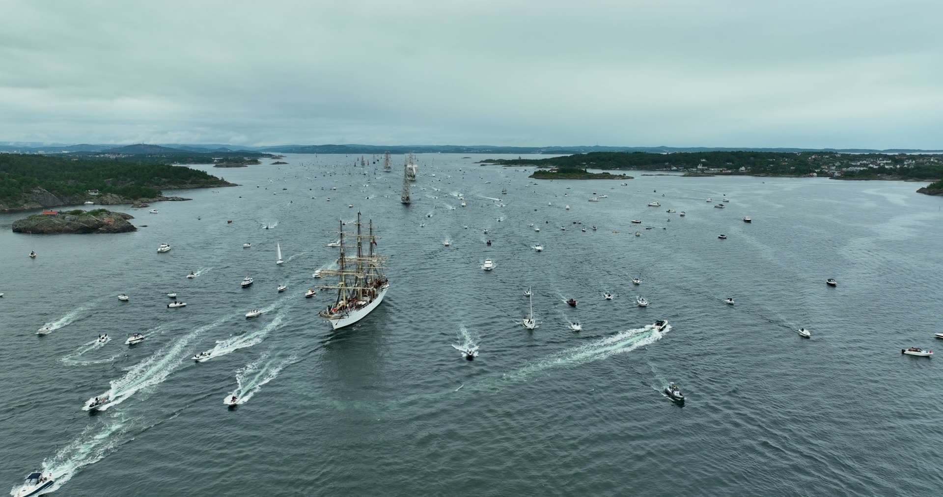 Tall ship parade escorted by small boats, Kristiansand, Norway