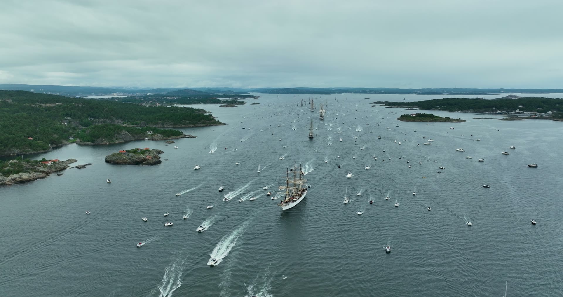 Tall ship parade escorted by small boats, Kristiansand, Norway