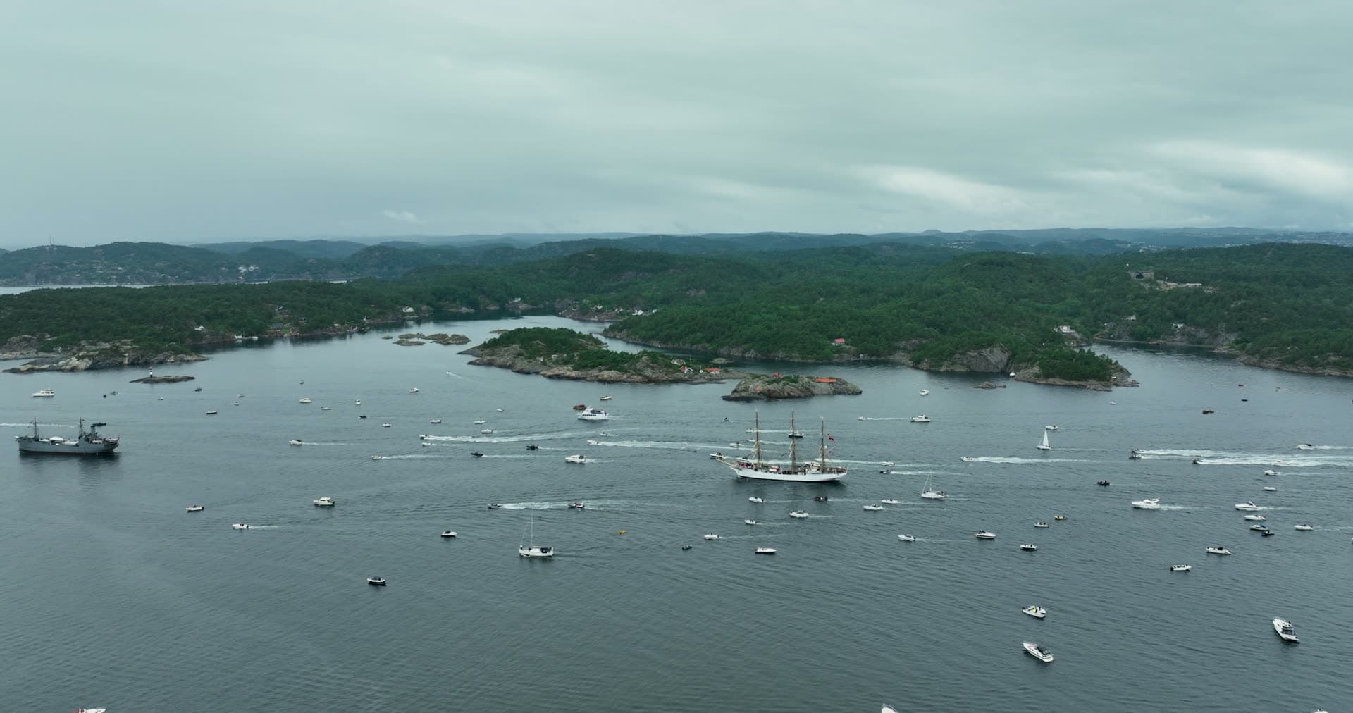 Tall ship escorted by boat swarm, Kristiansand, Norway