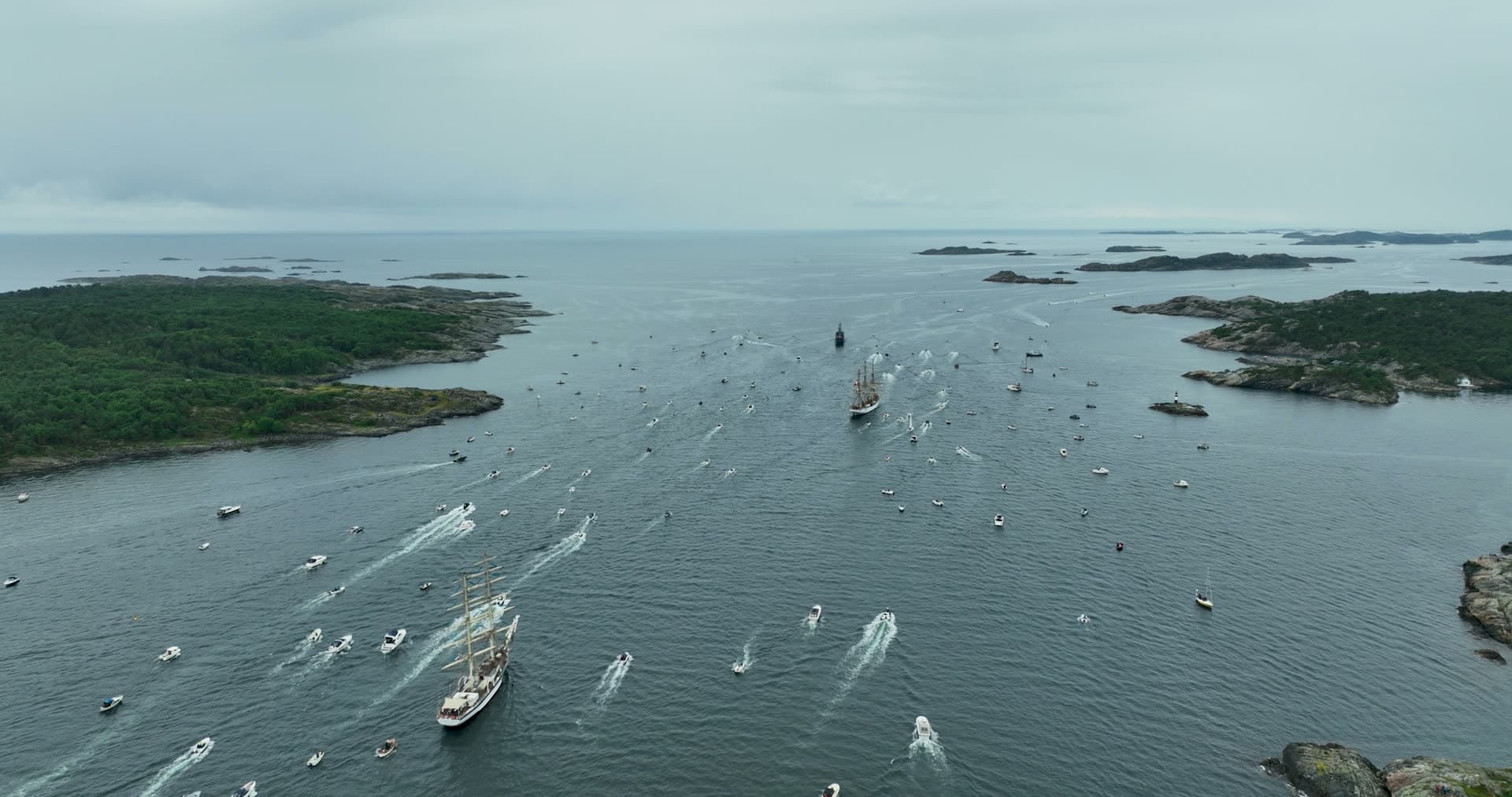 Tall ships parade escorted by small boats, Kristiansand, Norway